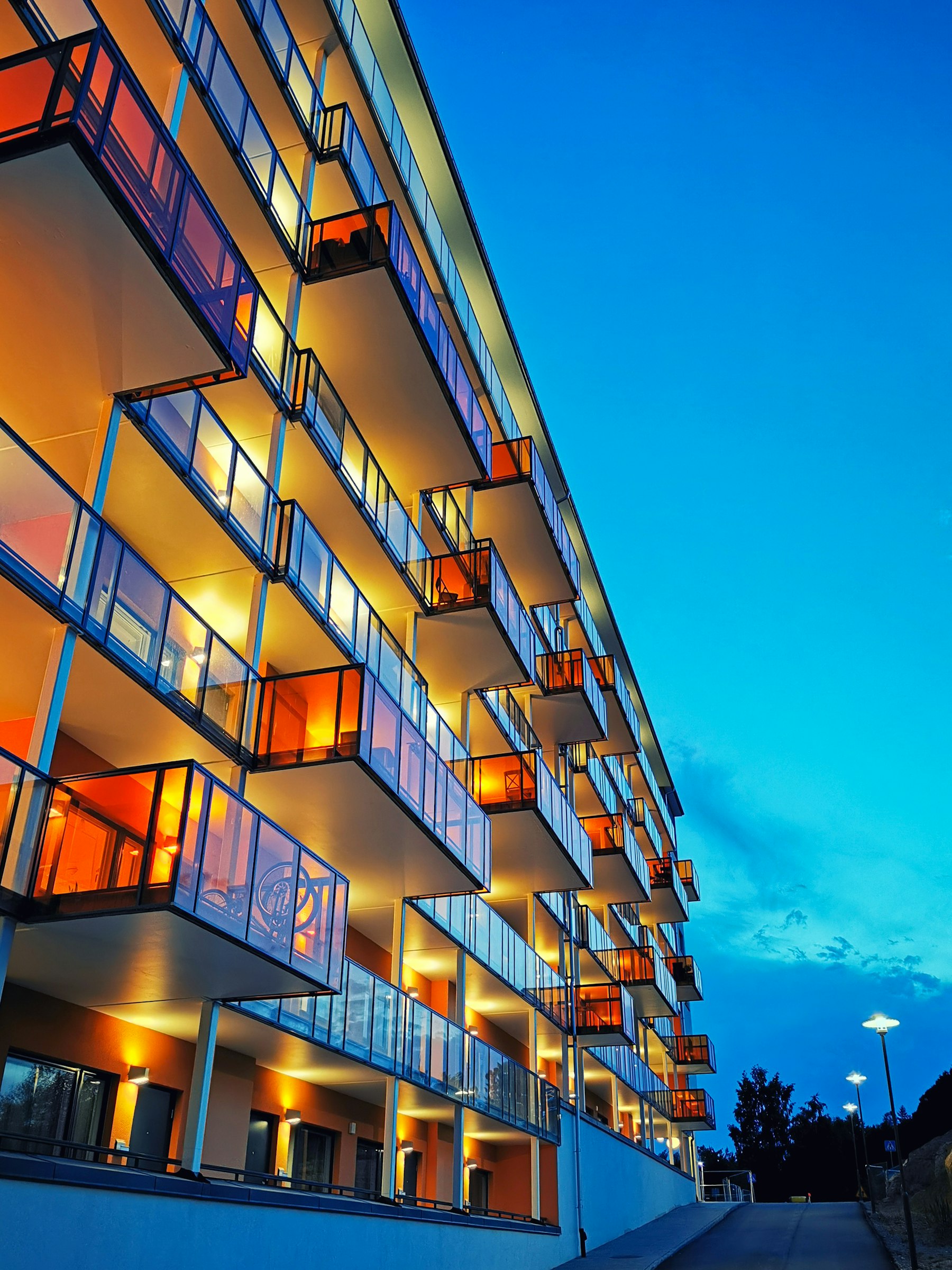 Illuminated residential tower at dusk